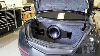 2009 Acura TL before and after photos of pre-fab box in the trunk. We custom built a bass enclosure to fit the trunk to house a Rockford sub and the mono amp.