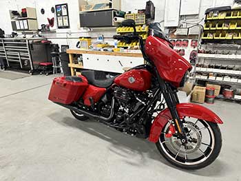 2022 Harley Davidson Street Glide. This beautiful red color was a custom build from the Black Hills Harley dealership. We added the Rockford Fosgate subwoofer kit to finish off the existing Rockford set up that was already on the motorcycle.