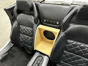 2008 Lamborghini Gallardo. Built a custom rear firing enclosure for a single Kenwood 8" sub that sits between the 2 front seats with matching diamond stitch pattern insert.