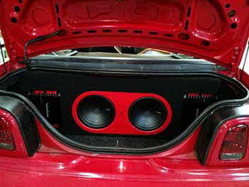 95 Ford Mustang. Insalled Pioneer Entertainment System, Kenwood speakers, Rockford Fosgate amps and Rockford subs. Built custom enclosure with amps trimmed in with red LED's.