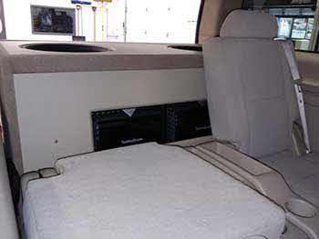 2007 Chevy Suburban. Installed Kenwood entertainment system, Rockford components up front and in the rear. Custom built huge 10 cubic foot enclosure that housed Rockford amps, and four 15" woofers with Rockford amps housed in the enclosure. Also installed Viper alarm remote start. This baby shook the ground!
