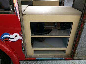 Added cosmetic plexiglass windows and finished wood trim attached to the sub woofer enclosure.