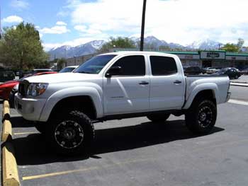 2006 Toyota Tacoma. Installed JVC AM/FM/CD/DVD Multimedia Entertainment System, 2 Rockford Fosgate Amplifiers, 2 ea. Clarion Slim Mount Woofers in a Custom Bass Enclosure. - Designed and installed by the Salt Lake City store.  