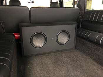 1990 Landrover Defender has no provision for an aftermarket radio so we installed a Kenwood receiver & Rockford amps into the center console. There's no depth in the doors for speakers so spacers were made and wrapped in vinyl & carpeted to match the doors for Pioneer speakers in the front & rear. Installed Hertz speakers into the dash. Custom made sealed enclosure for 2 Kenwood subs. Sounds and looks great!