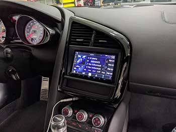 2012 Audi R8 V10. We upgraded the factory head unit to a Kenwood Apple Car Play & Android Auto, integrating the OEM back up camera and the B&O amplified factory system and steering wheel controls. Vehicle is now updated with Bluetooth, Apple Car Play and USB input support.