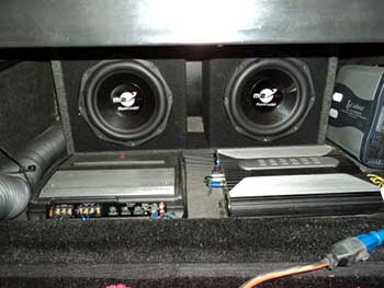 '96 Freightliner. Installed Kenwood Bluetooth HD receiver with flush mounted USB port and 10" touch screen to control laptop in work station sleeper. Clarion 4-channel amp with Planet Audio 10" sub woofers in ported box under sleeper. 