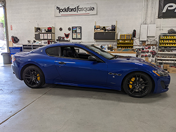 2017 Maserati Granturismo Sport. Made custom dash piece to house Pioneer floating tablet  headunit. Custom built subwoofer enclosure for Rockford Fosgate 12". Replaced all interior speakers with Hertz speakers. Added back up camera and retained steering wheel controls. Mounted amp and factory head unit (to keep CAN network intact) in rear cargo floor compartment.
