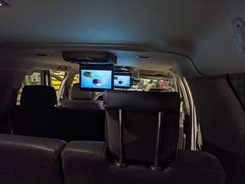 2017 GMC Yukon. Installed two 10" Audiovox overhead monitors. They are linked together and sound is piped in through the auxilliary audio jack input in the center console.